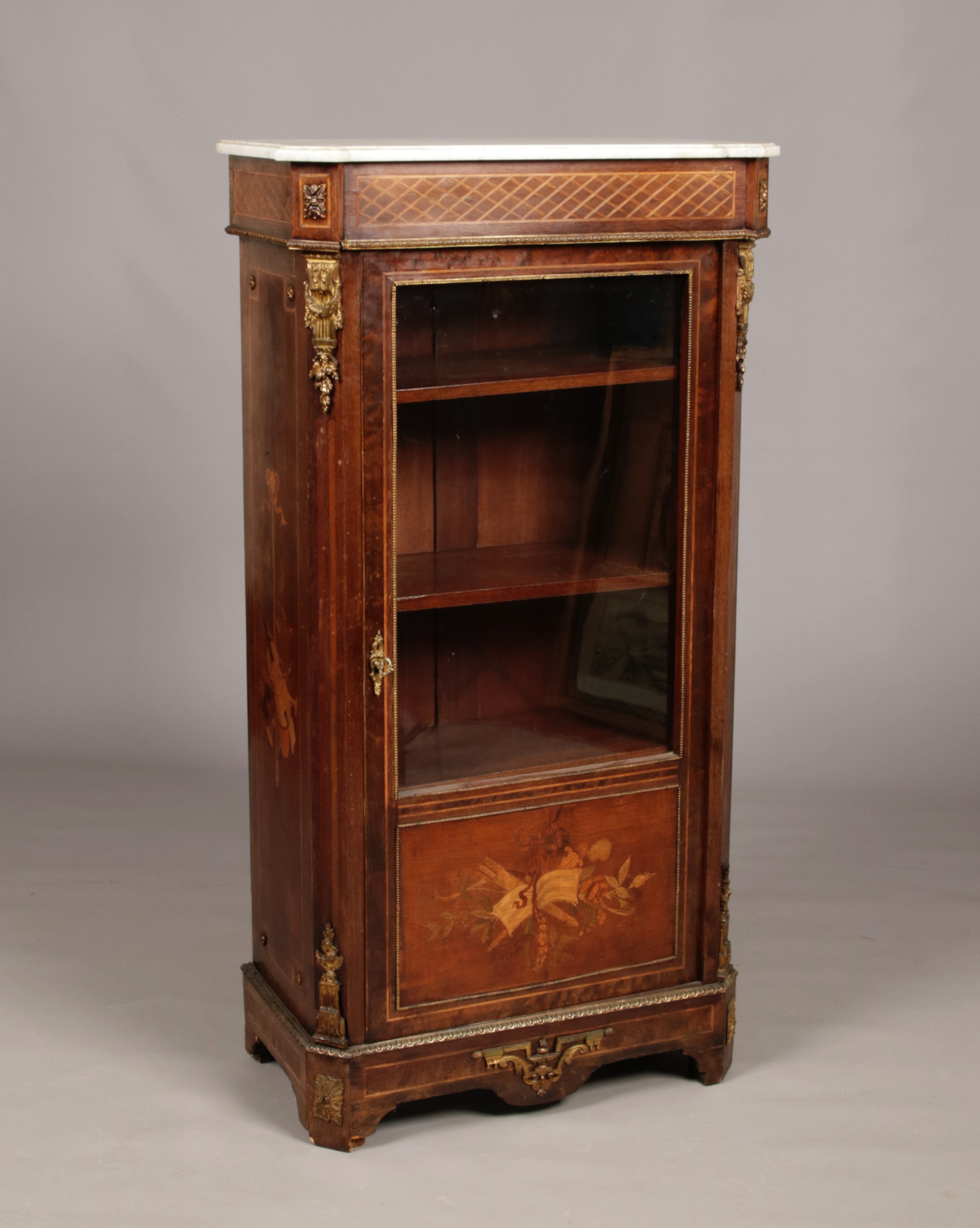 A 19th century mahogany marble top pier cabinet with gilt metal mounts. With marquetry inlay