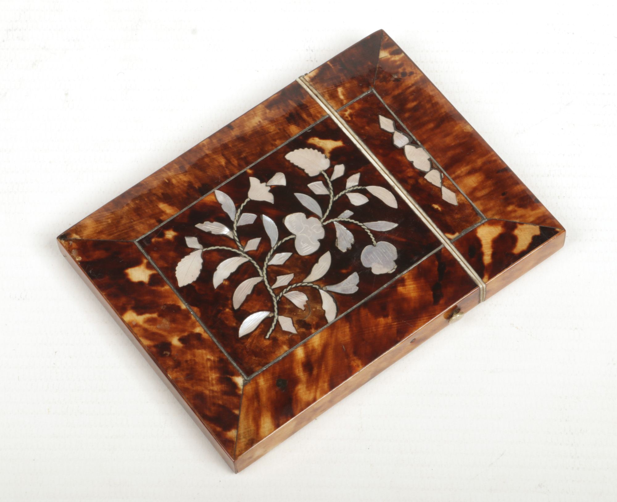 A Victorian tortoise shell card case inlaid with mother of pearl depicting flower sprigs, 10.5cm.