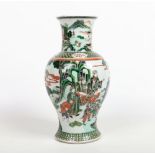 A large 19th century Chinese baluster shaped famille verte vase. The everted neck painted with a