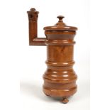 A 19th century treen potpourri jar and cover modelled in the form of a stove and raised on turned