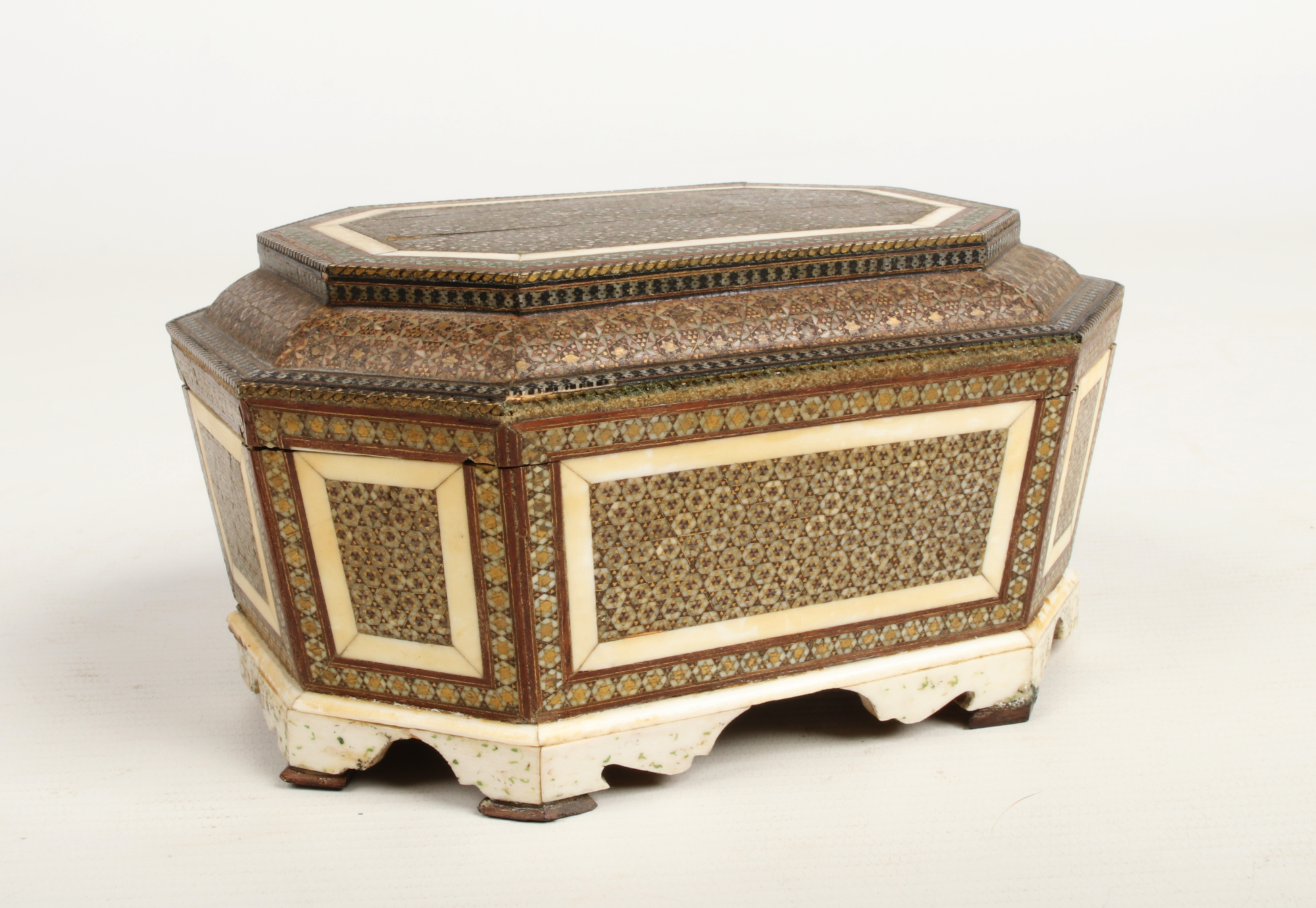 A 19th century Persian wood, brass and ivory micro mosaic casket of canted rectangular form and
