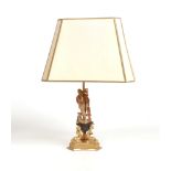 A mid 20th century French rise and fall gilt bronze lamp raised on a triform base with dolphins.