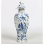 A 19th century Chinese blue and white baluster vase and cover. With a moulded lion dog finial and