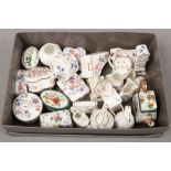 A box of mostly Hammersley bone china trinket boxes and ornaments.