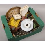 A box of collectables including advertising tins, glass drawer pulls, cigar boxes, playing cards,