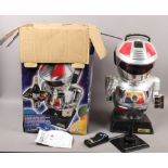 A boxed radio controlled scooter 2000 robot toy.