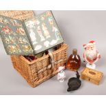 A basket of mixed collectables to include full and sealed Dimple Whisky, vintage Christmas