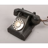 A black vintage Siemens Brothers & Co Ltd Rotary dial telephone.