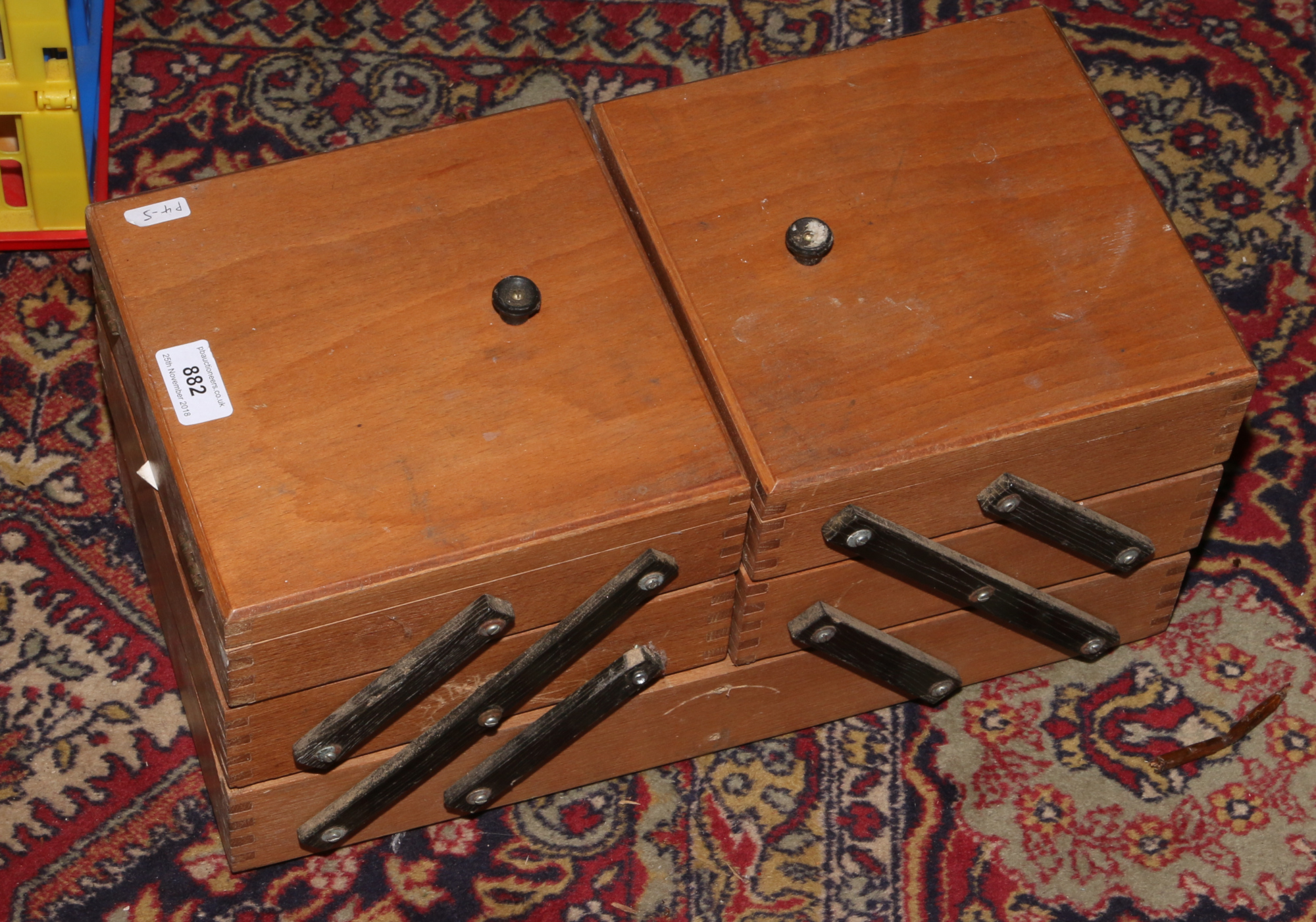 A light oak cantilever work box.