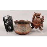 A 19th century Indian or Persian seamed copper vessel with chased scroll work, along with two