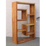 A tropical hardwood shelving unit.