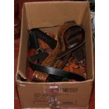 A box of good quality leather gun holsters to include belts, shoulder straps etc.