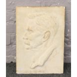 A plaster cast head and shoulders portrait bearing signature John Friend 37.