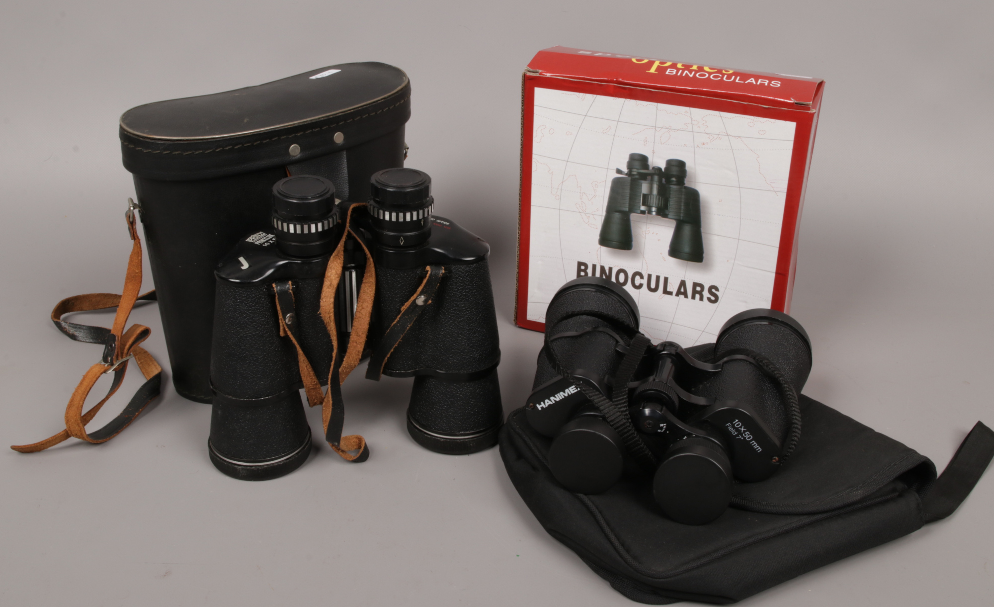 Three cased and boxed pairs of binoculars to include Hanimex 10 x 50 field Prinzlux 10 x 50 and a