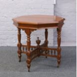 A Victorian octagonal walnut window table.