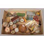 A tray of collectables including vintage Dinky toys, cotton reels, novelty hand painted wooden