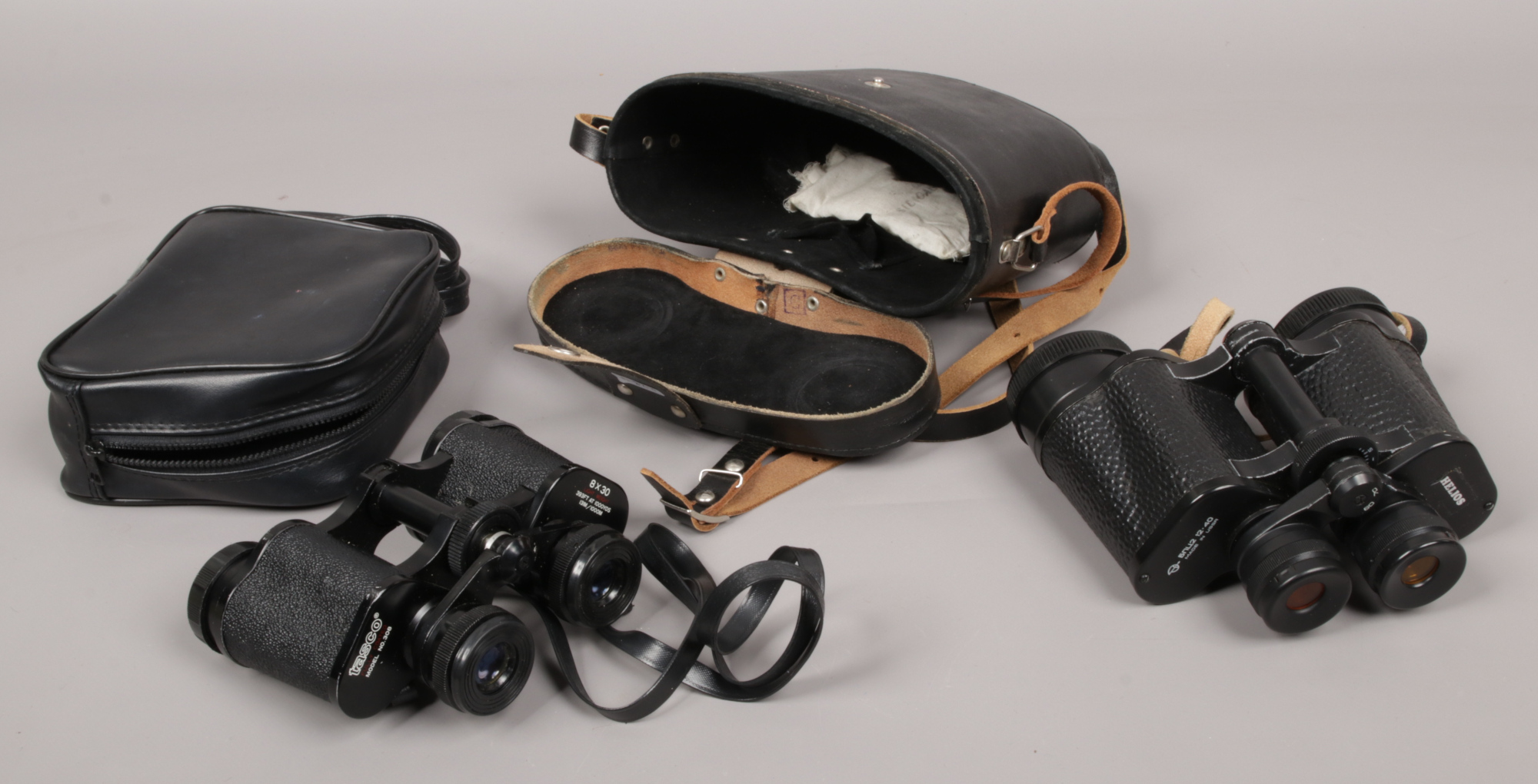 A cased set of Russiam Helios binoculars, along with a cased set of Tasco model No. 308 binoculars.