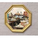 A gilt framed octagonal wall mirror, 78cm x 78cm.