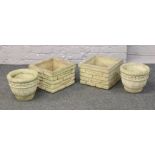 Two pairs of concrete planters one pair with brick work decoration the other with scroll and