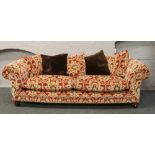 A good quality four seat sofa upholstered in red and gold velvet moquette upholstery raised on