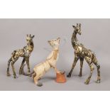 Two composite giraffes and Country Artist model of a playful cat.