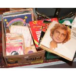 A box of L.P records and singles to include Elvis, Shirley Bassey, Barry Manilow etc.