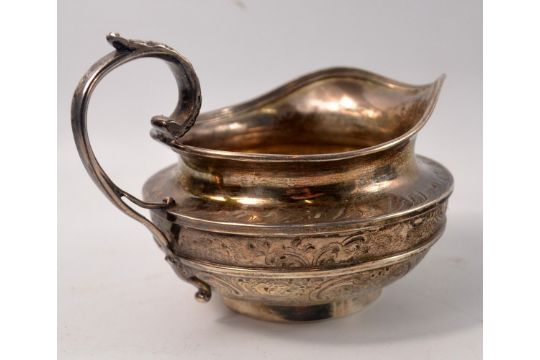 A pair of silver napkin rings in presentation box, with an Indian white metal cream jug. - Image 5 of 6