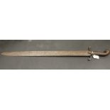 A metal Persian style short sword, the blade (68cm) decorated with flowers and vines