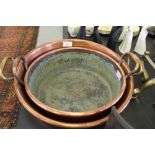 2 copper handled pans