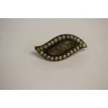 A Victorian seed pearl and gilt metal mourning brooch (two pearls missing)