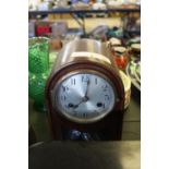 Arch top mahogany mantle clock