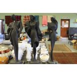 3 tall black figurines