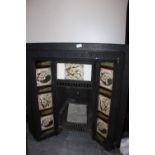 Victorian cast iron fire surround, inset with pottery tiles