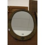 Oval brass framed mirror
