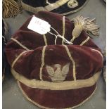 Late 19th/Early 20th Century red velvet and gilt brocade sporting cap, with tassel and embroidered