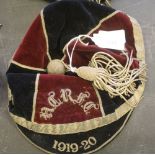 Early 20th Century quartered red and blue velvet and gilt brocade sporting cap, with tassel,