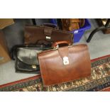 Three leather brief cases