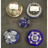 Five glass paperweights