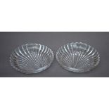 A pair of modern moulded glass dishes of scallop shape, thought Lalique, 27.5cm x 26.5cm Good