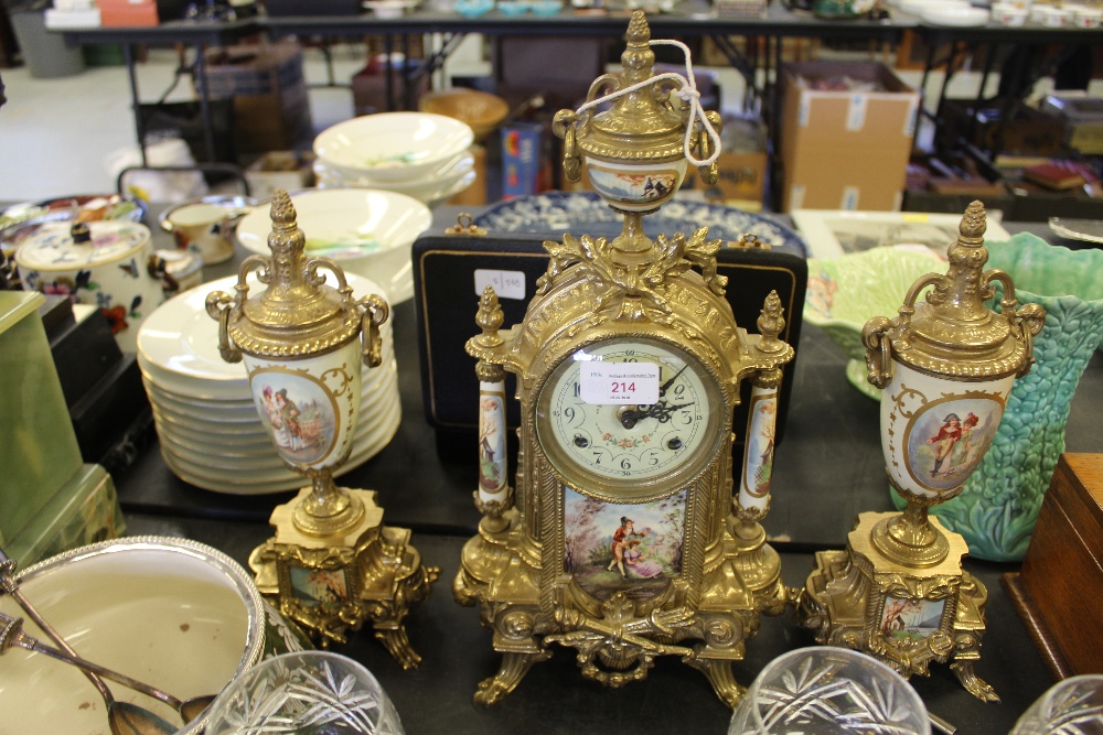 Brass & porcelain mantel clock & garnitures