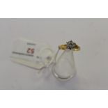 18ct Gold & Diamond Ring - Set with 7 Diamond Brilliants, marked 18ct and with textured shoulders