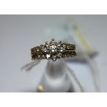 A 14k Gold all Diamond Set Dress Ring with central floral motif and set with 25 brilliant cut