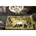 Brass trivet with tiger design and brass horse doorstop