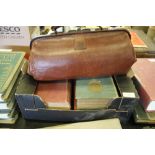 Doctors leather Gladstone bag and medical books