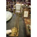 Set of brass fire irons and dogs