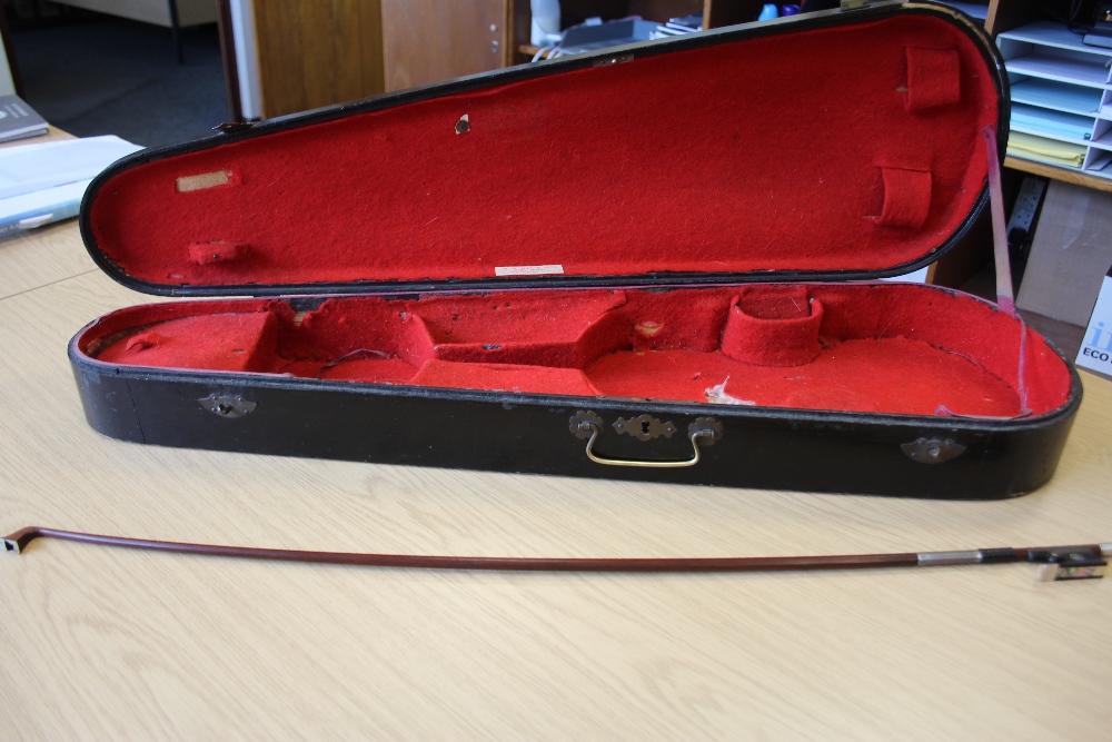 A silver mounted violin bow branded VF Fetique A Paris. Octagonal stick, full size, together with