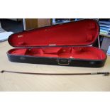 A silver mounted violin bow branded VF Fetique A Paris. Octagonal stick, full size, together with