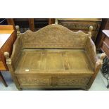 Carved camphor wooden settle with storage underneath