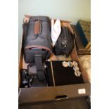 Box of binoculars and video cameras