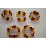 Five simulated amber bracelets